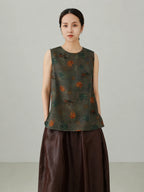 Close-up view of Xiangyunsha mulberry silk vest top featuring traditional elephant pattern print and premium silk texture