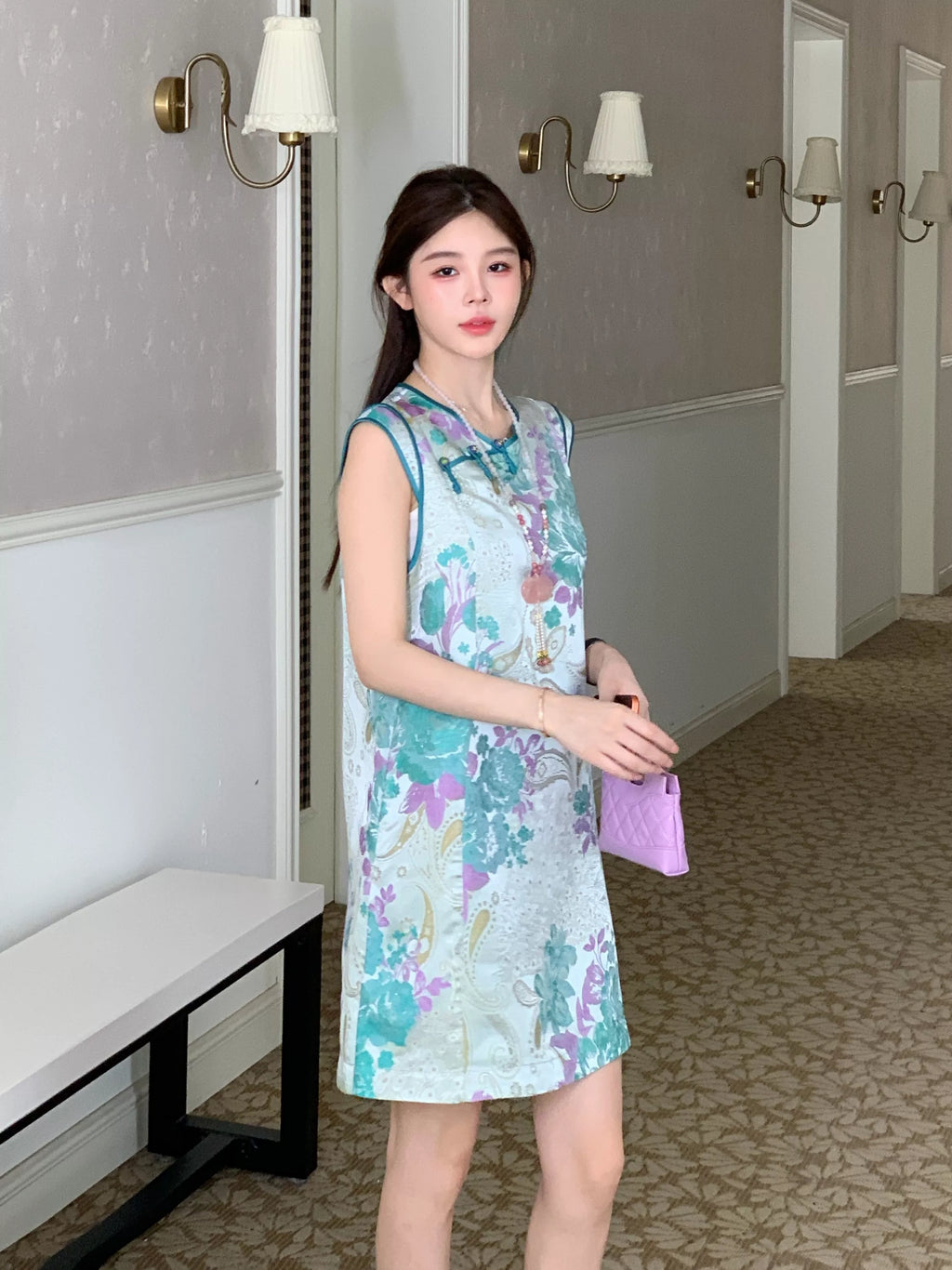 Model wearing the Xiaolan floral new Chinese dress with a relaxed fit and turquoise floral print