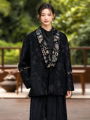 Closer front view of the Yanchuan jacket showing floral jacquard and multicolor embroidery around the neckline and sleeves.
