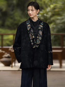Front view of the Yanchuan jacket showing its open neckline, tonal floral pattern and embroidered trim.