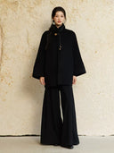 Full-length outfit featuring Yangui black wide-leg pants with a black jacket and black shoes.