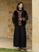 Three-quarter view of the Yanrong jacket showing gold-tone embroidery along the front and cuffs