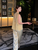 Back view of a yellow Cheongsam vest with floral embroidery, paired with matching wide-leg pants, standing in a stylish interior, highlighting the A-line silhouette and comfortable fit.