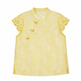 Flat lay of a yellow jacquard blouse with a mandarin collar, lace cap sleeves, and a side button closure, crafted from 80% Viscose and 20% Polyamide.
