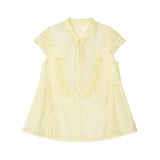 Flat lay of a yellow lace-trimmed Cheongsam top with a mandarin collar, delicate floral embroidery, and short lace sleeves, crafted from 80% Viscose, 20% Polyamide.